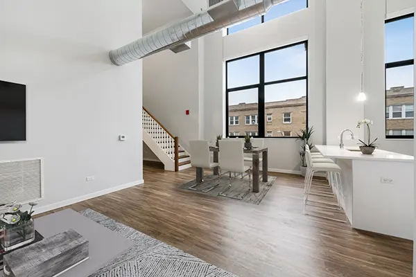 Light-filled living and dining with loft-like volume